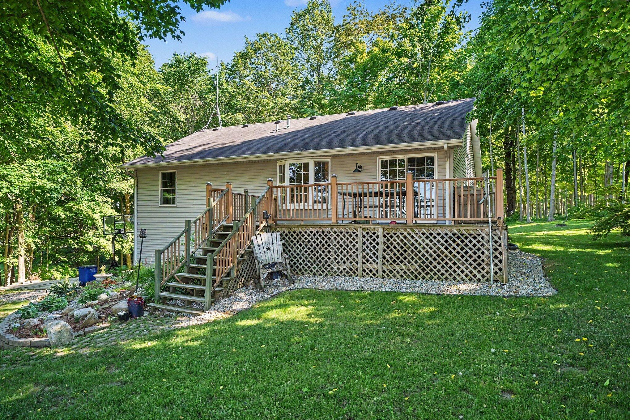 7563 East 400 North Rolling Prairie, IN 46371 - Photo 14 of 17 a front view of a house with a garden