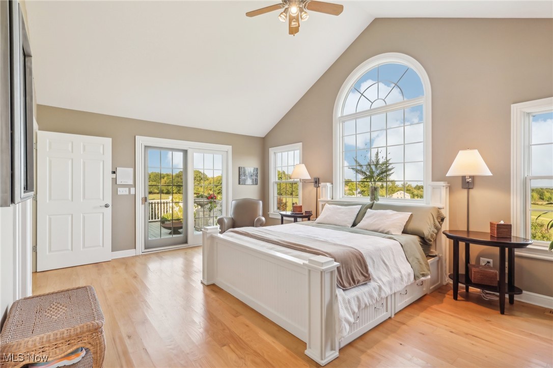 17240 Nash Road Middlefield, OH 44062 - Photo 18 of 43 Bedroom featuring light hardwood / wood-style flooring, ceiling fan, vaulted ceiling, and multiple windows