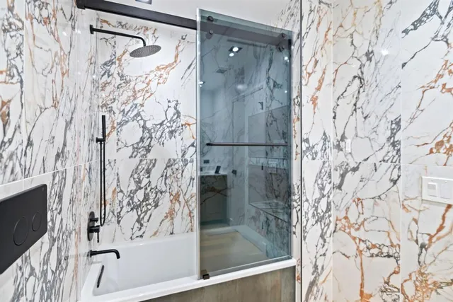 a bathroom with a shower curtain and a bathtub