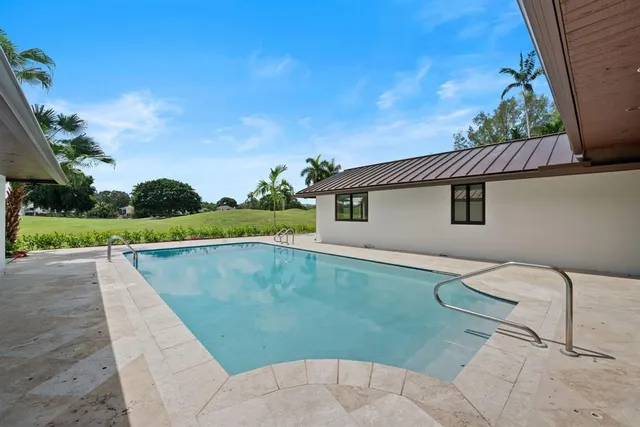 a view of a house with a swimming pool