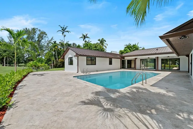 a house view with a backyard space