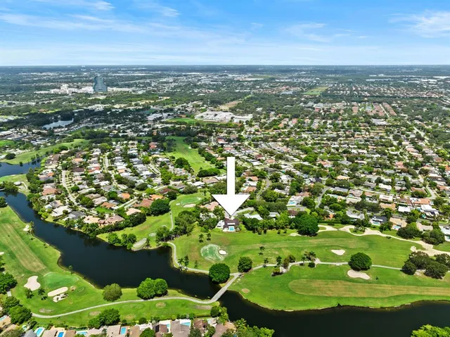 an aerial view of a house with a garden