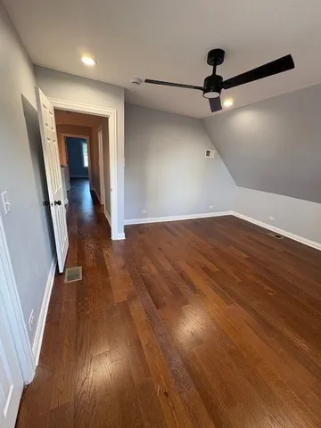 wooden floor in an empty room with a mirror