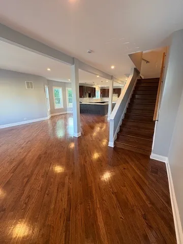 a view of gallery with wooden floor