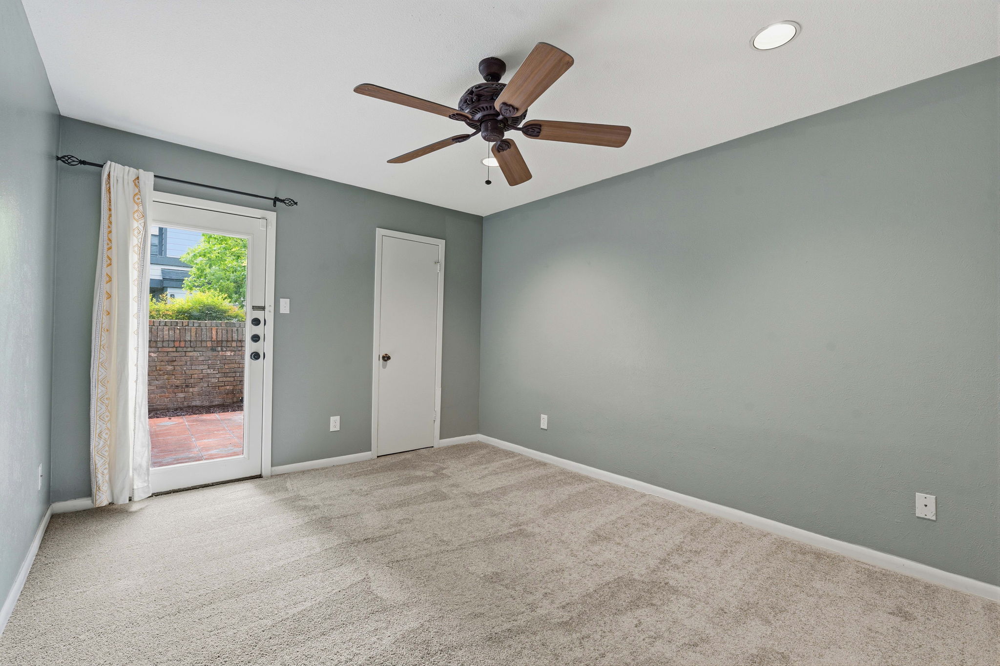 1748 Ohlen Road, Unit 24 Austin, TX 78757 - Photo 16 of 30 a view of an empty room with a ceiling fan