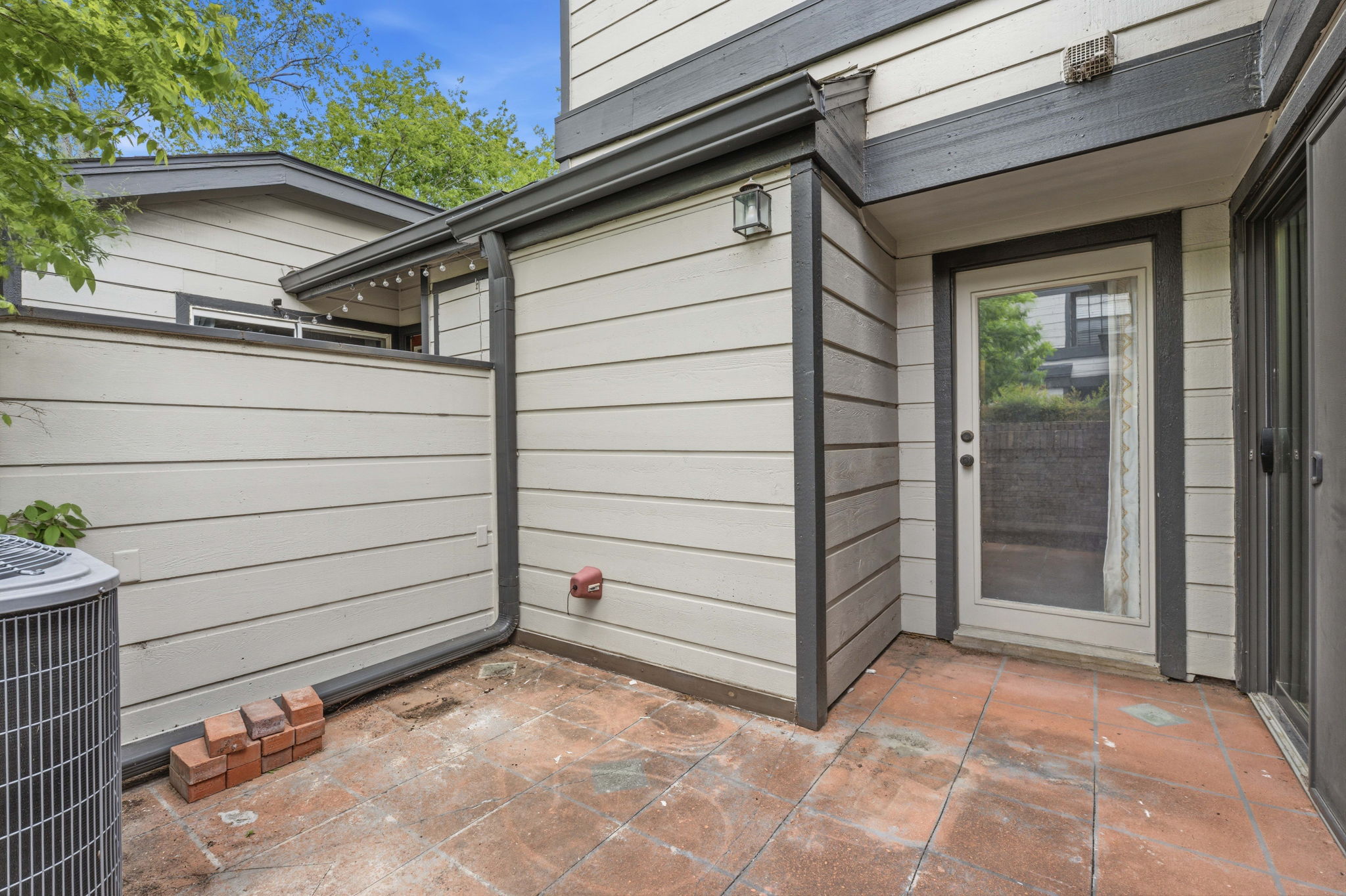 1748 Ohlen Road, Unit 24 Austin, TX 78757 - Photo 25 of 30 a view of a house with a door and wooden bench