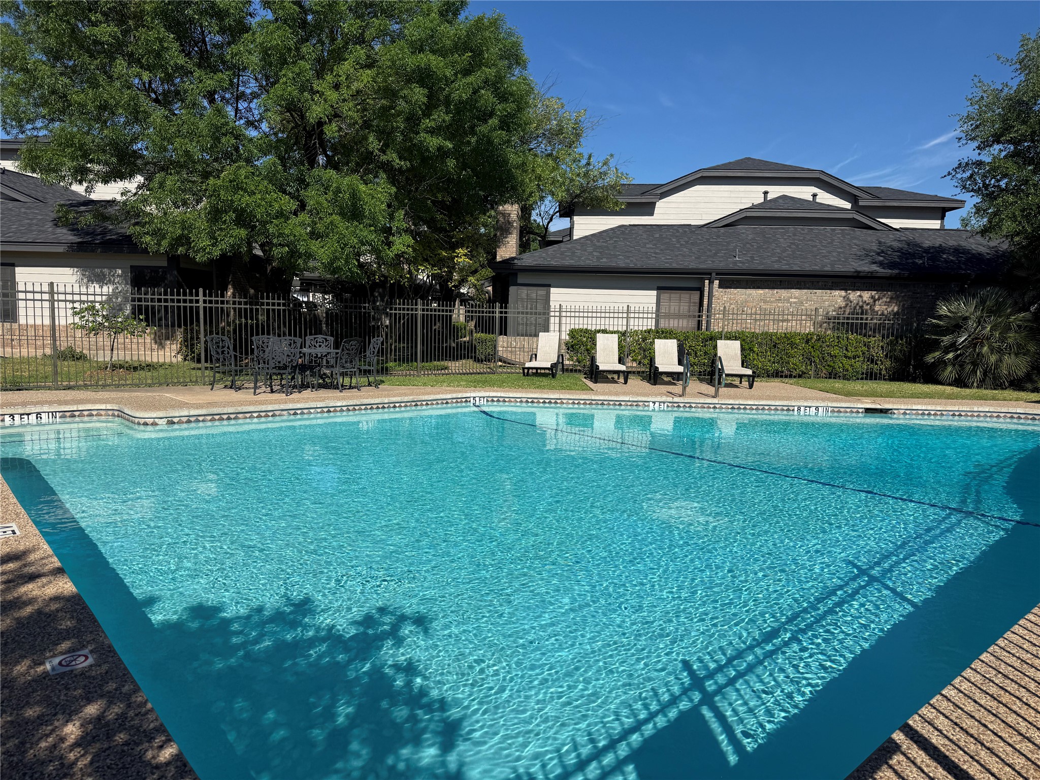 1748 Ohlen Road, Unit 24 Austin, TX 78757 - Photo 5 of 30 a view of a house with a yard and sitting area