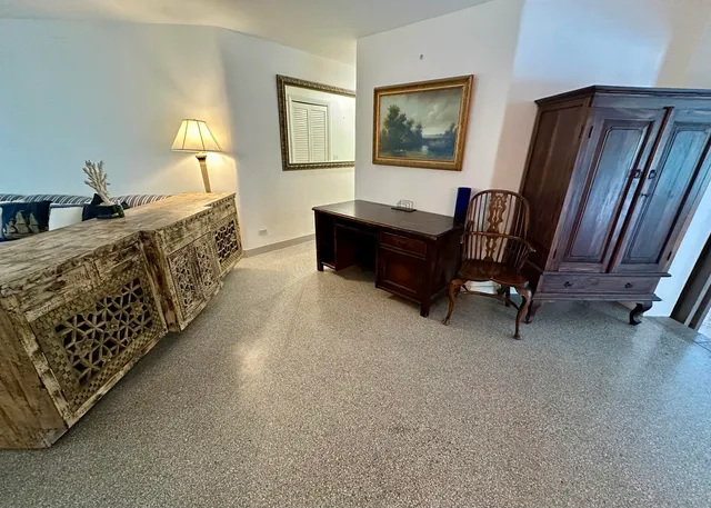 a dining room with a table and chairs