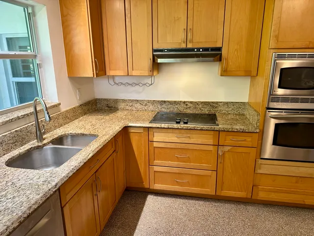 a spacious bedroom with a bed and a window