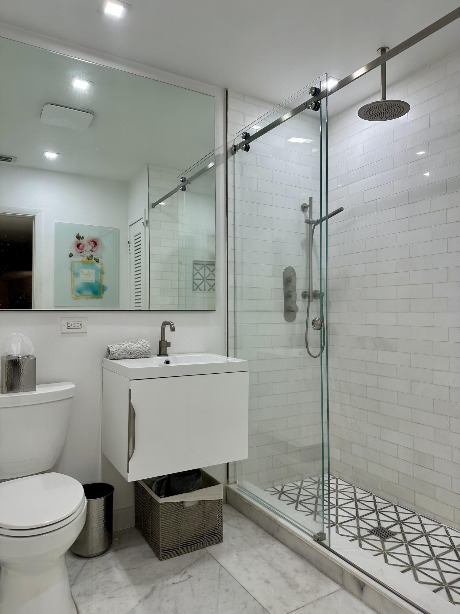 212 Kings Lynn Delray Beach, FL 33444 - Photo 33 of 53 a bathroom with a sink toilet and shower