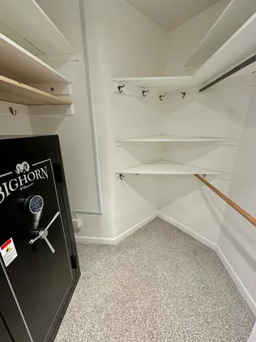 a view of a backyard with table and chairs