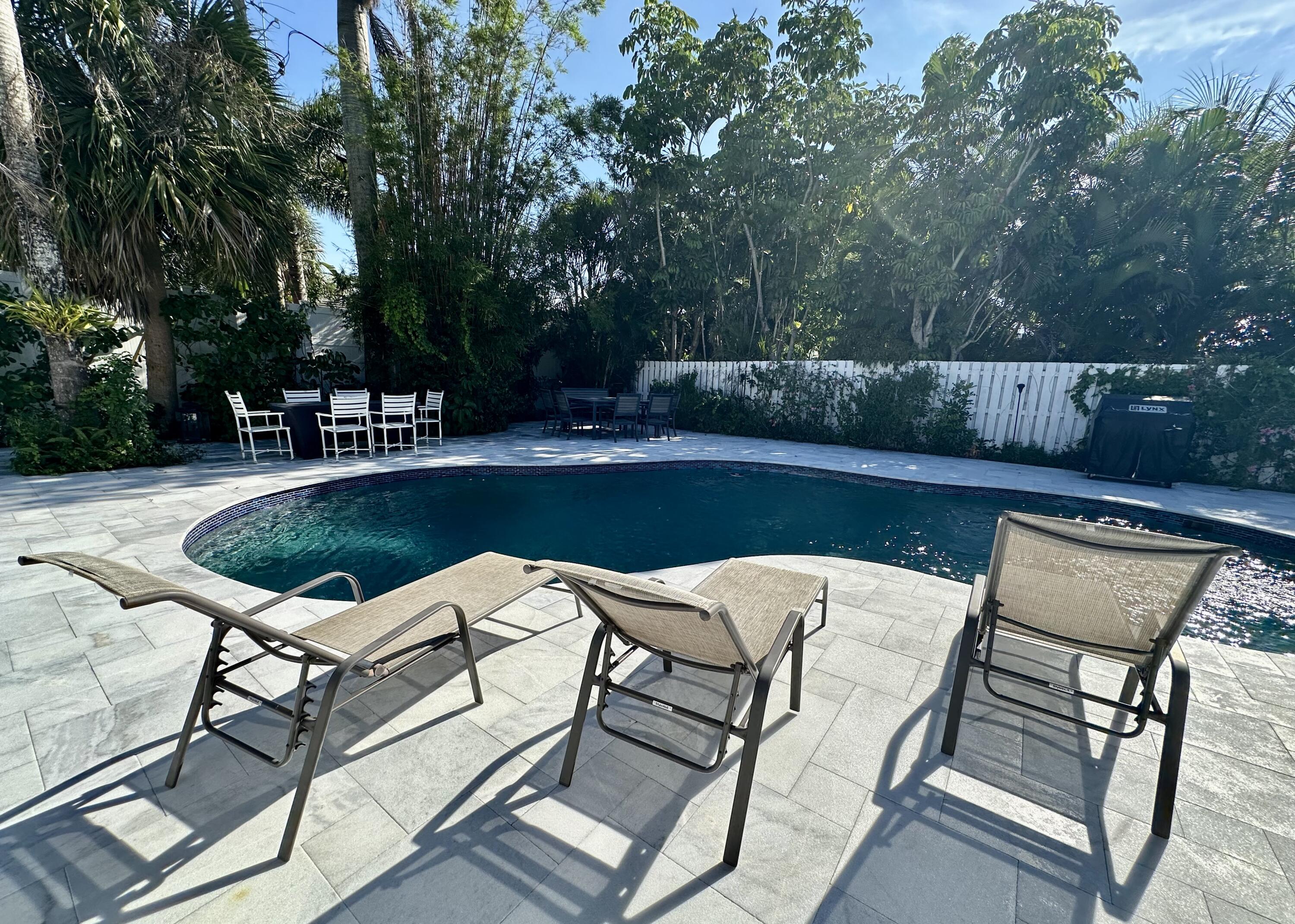 212 Kings Lynn Delray Beach, FL 33444 - Photo 42 of 53 a view of a chairs and table on the terrace