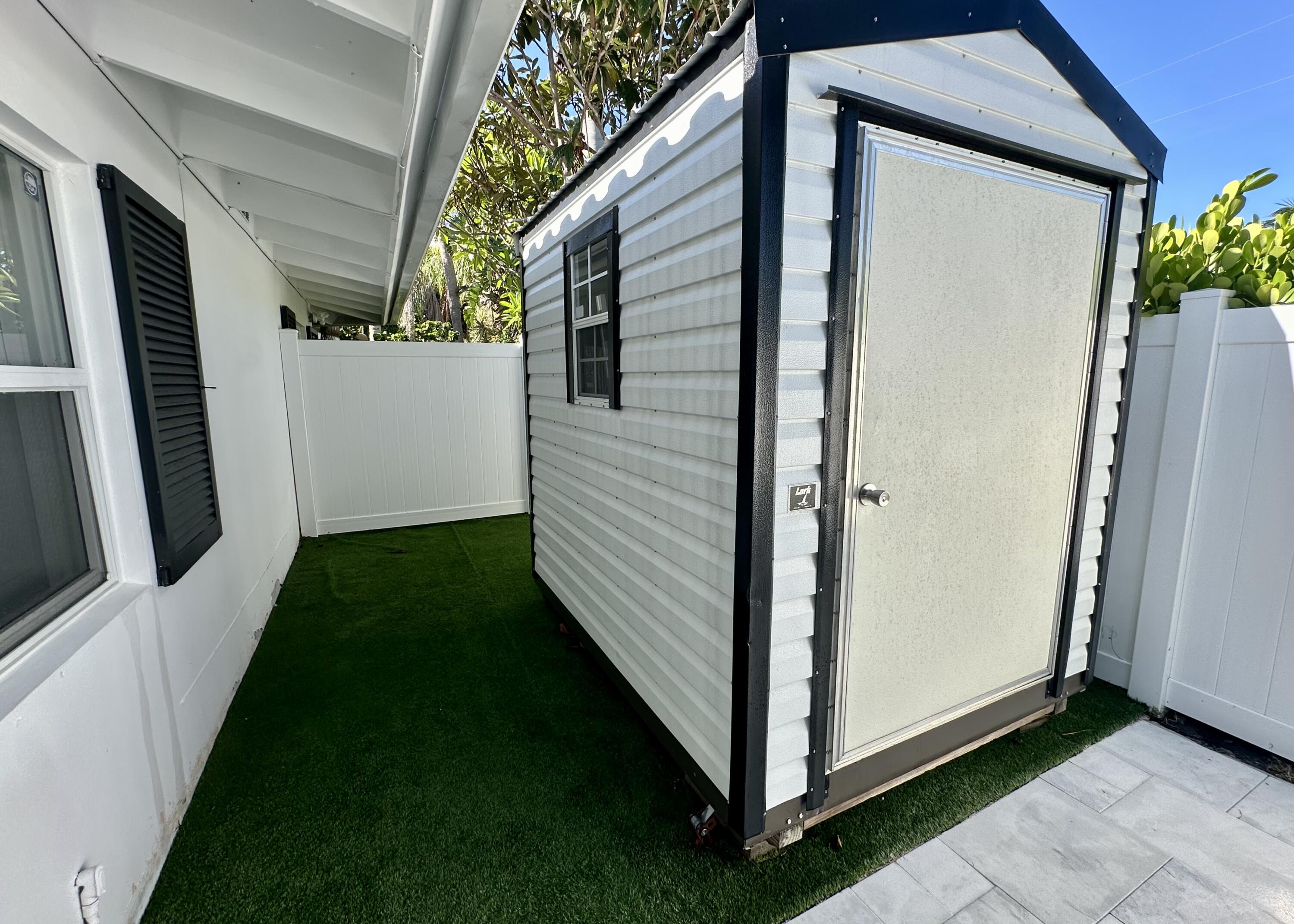 212 Kings Lynn Delray Beach, FL 33444 - Photo 45 of 53 a view of a porch with a yard