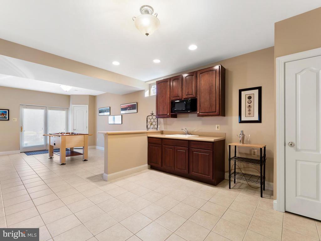 12128 Sheets Farm Road North Potomac, MD 20878 - Photo 34 of 54 Lower Level Bar or Kitchen area