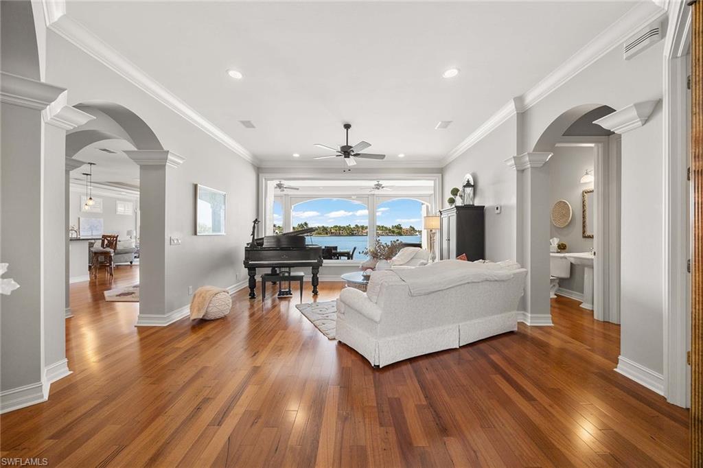 1942 Kingfish Road Naples, FL 34102 - Photo 14 of 50 a living room with furniture and a wooden floor