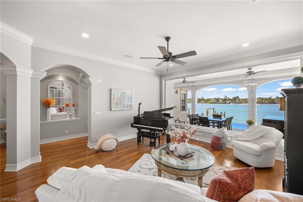 1942 Kingfish Road Naples, FL 34102 - Photo 15 of 50 a living room with furniture and a large window