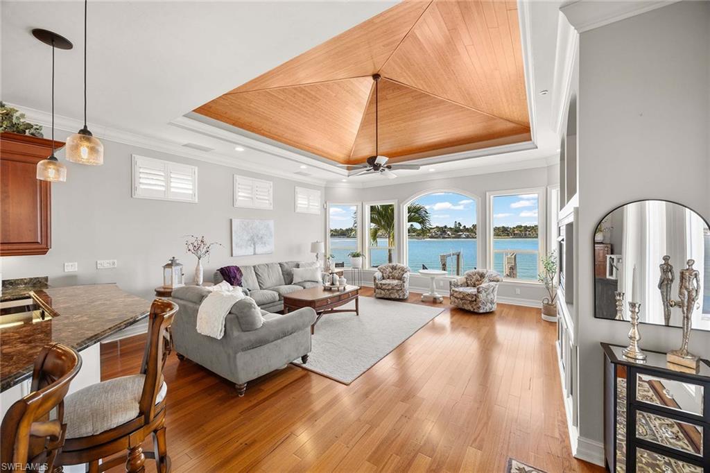 1942 Kingfish Road Naples, FL 34102 - Photo 16 of 50 a living room with furniture and a large window