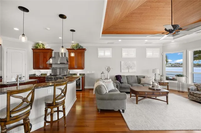 a living room with furniture a rug and white walls