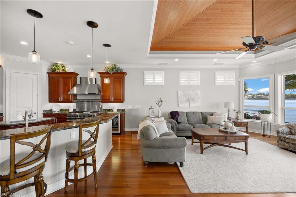 1942 Kingfish Road Naples, FL 34102 - Photo 19 of 50 a living room with furniture a rug and white walls