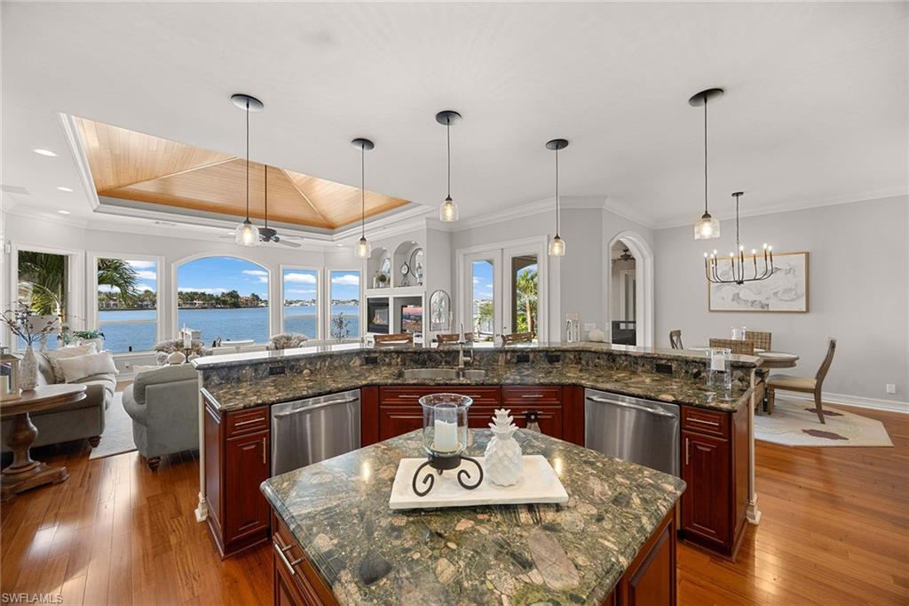 1942 Kingfish Road Naples, FL 34102 - Photo 50 of 50 a large kitchen with a table and chairs