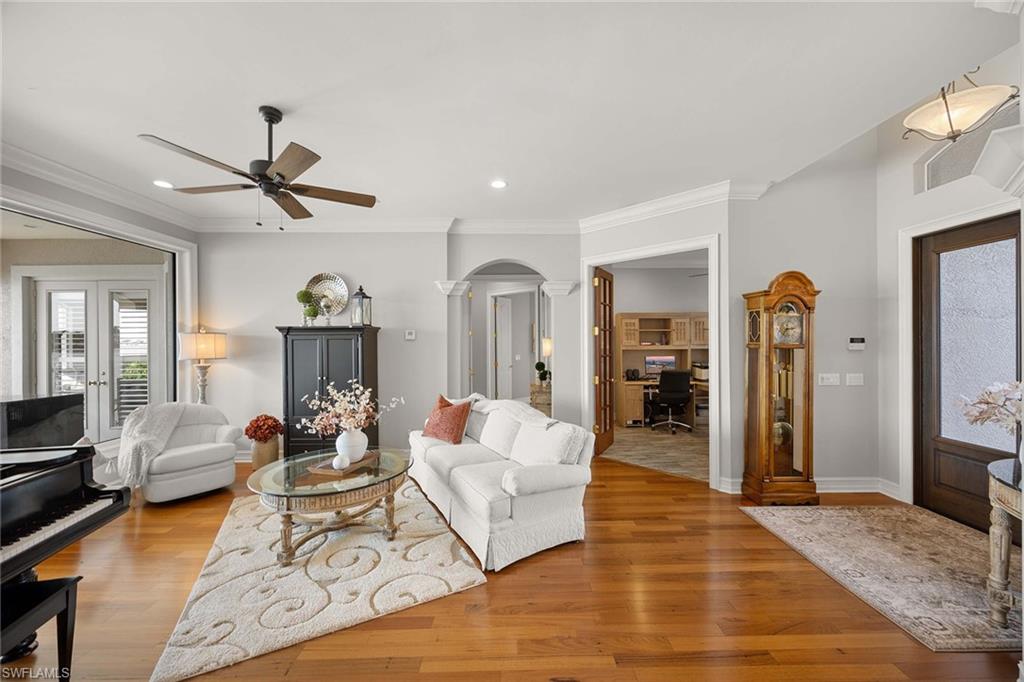1942 Kingfish Road Naples, FL 34102 - Photo 22 of 50 a living room with furniture and a wooden floor