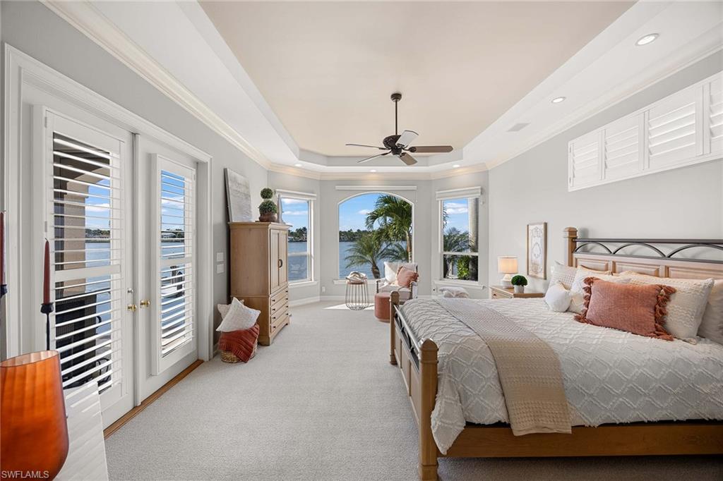 1942 Kingfish Road Naples, FL 34102 - Photo 23 of 50 a bedroom with furniture and a window