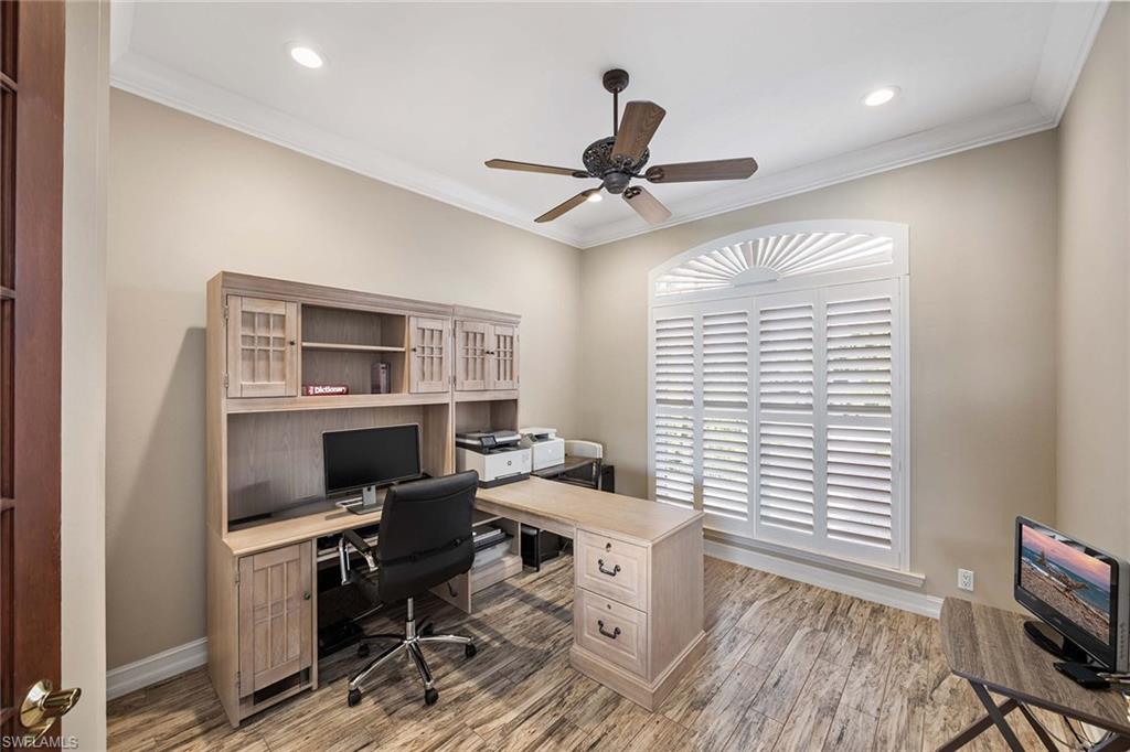 1942 Kingfish Road Naples, FL 34102 - Photo 31 of 50 a workspace with furniture window and a ceiling fan