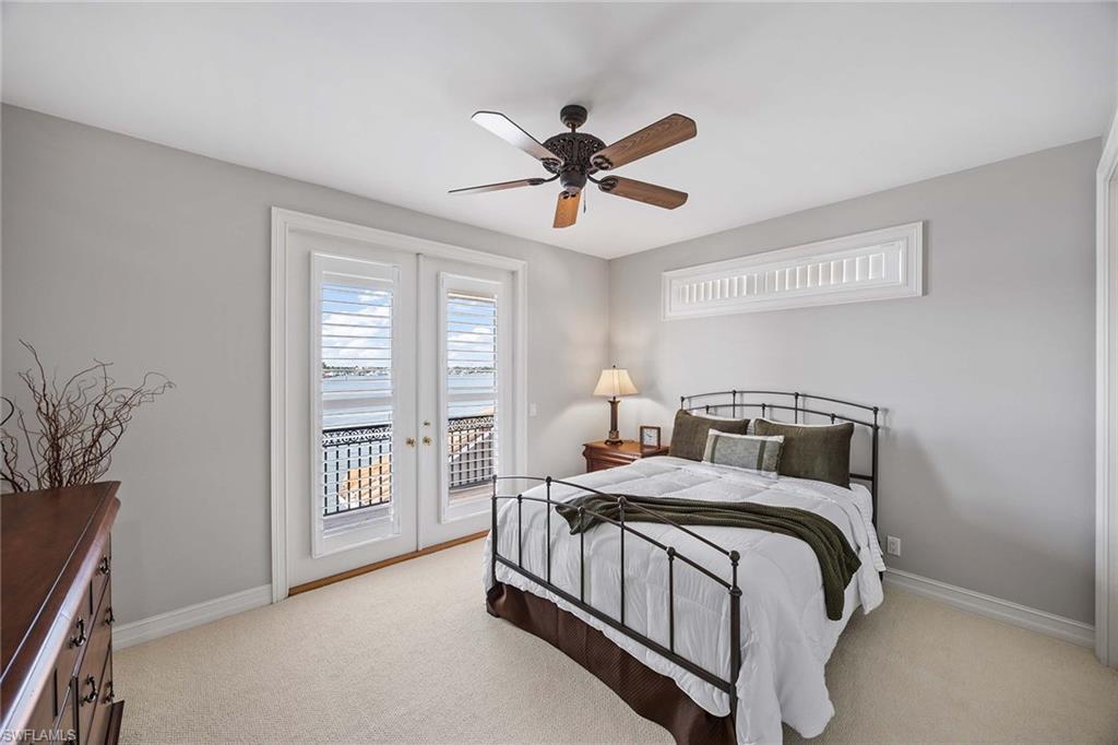 1942 Kingfish Road Naples, FL 34102 - Photo 37 of 50 a bedroom with a bed and a window