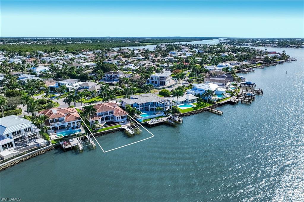 1942 Kingfish Road Naples, FL 34102 - Photo 42 of 50 an aerial view of a city with lots of residential buildings