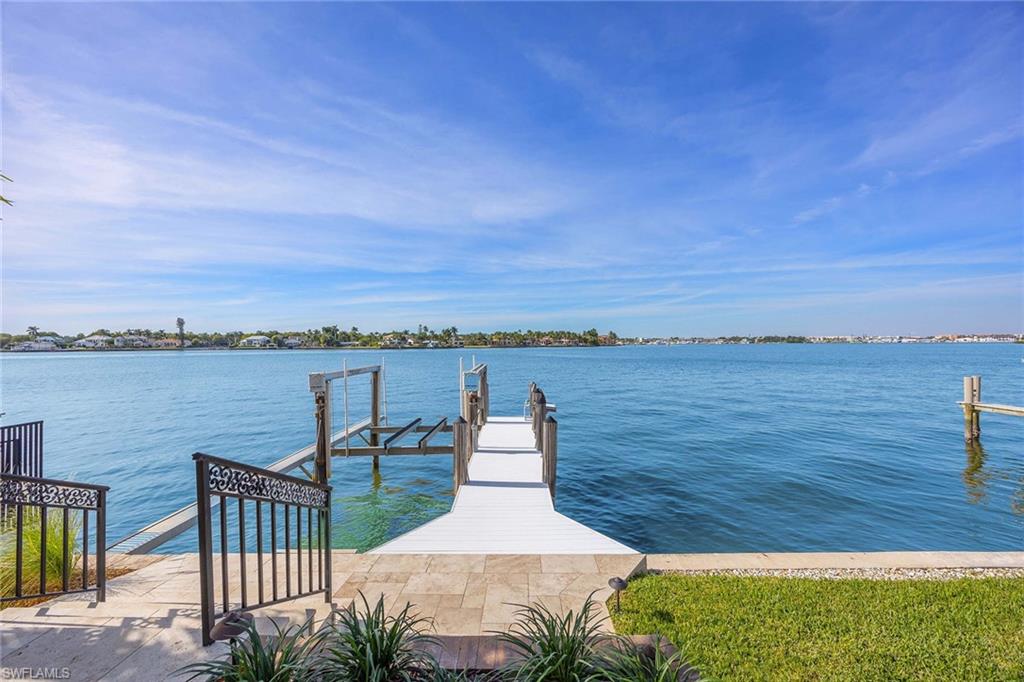 1942 Kingfish Road Naples, FL 34102 - Photo 45 of 50 a view of a lake with a outdoor space