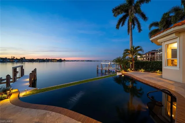 a view of a swimming pool with a lake view
