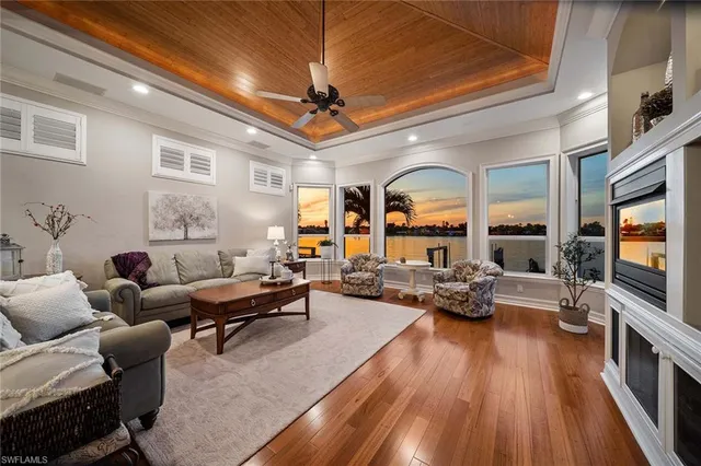 a living room with fireplace furniture and a flat screen tv