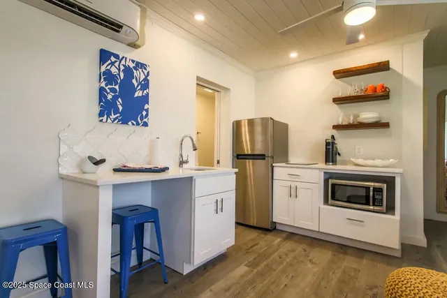 a kitchen with a stove and a refrigerator
