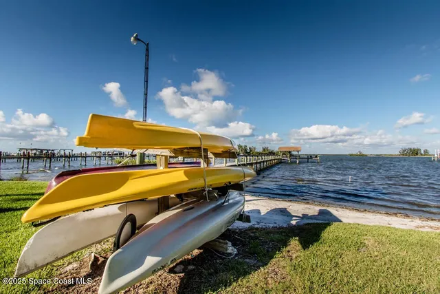 a swimming pool with outdoor seating