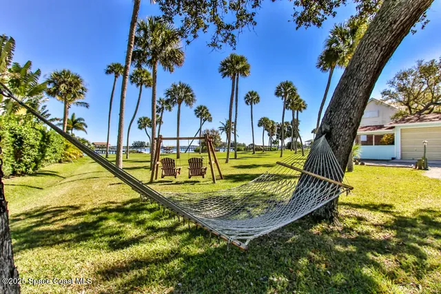 a view of swimming pool with a table and chairs