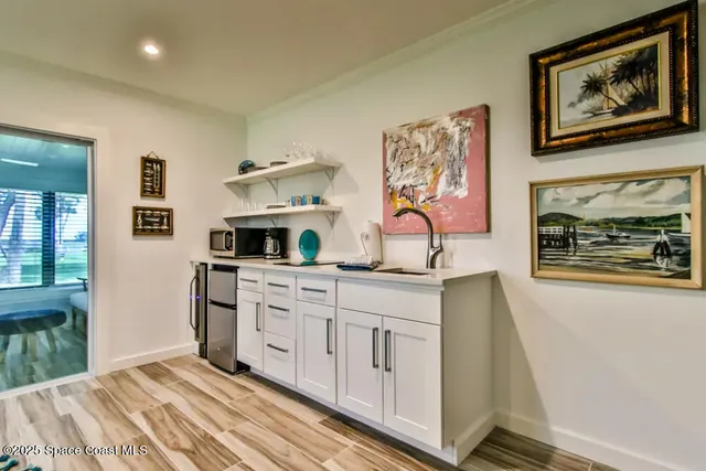 a bedroom with furniture and painting on the wall