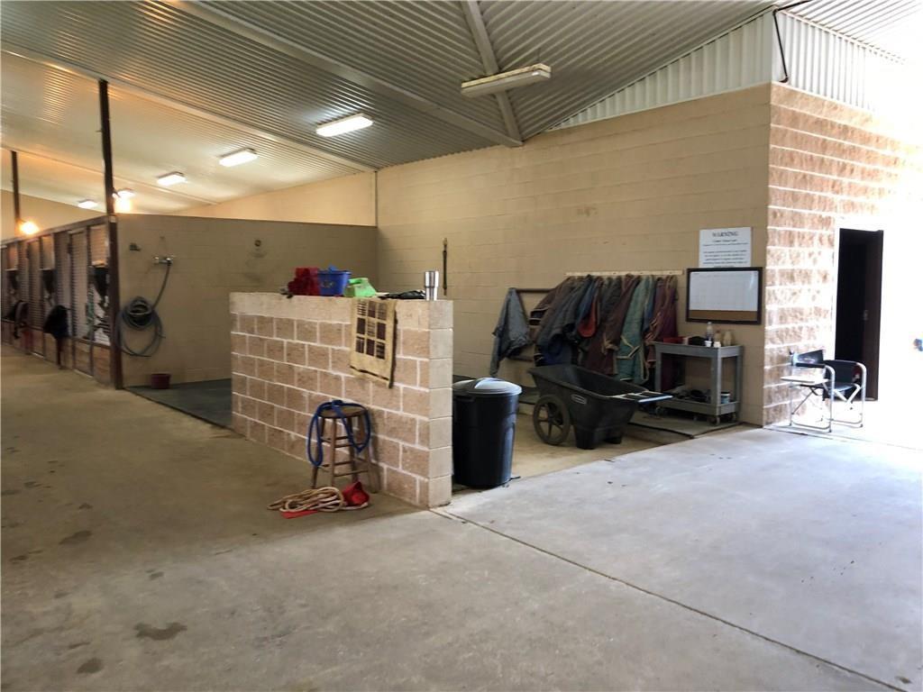 1019 Spring Hill Road Aubrey, TX 76227 - Photo 14 of 26 Garage with metal wall