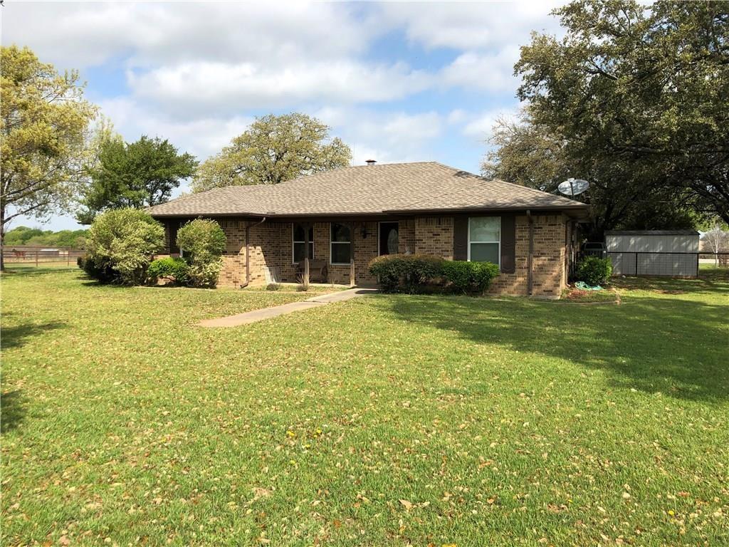 1019 Spring Hill Road Aubrey, TX 76227 - Photo 22 of 26 Ranch-style home with brick siding, a front yard, and fence