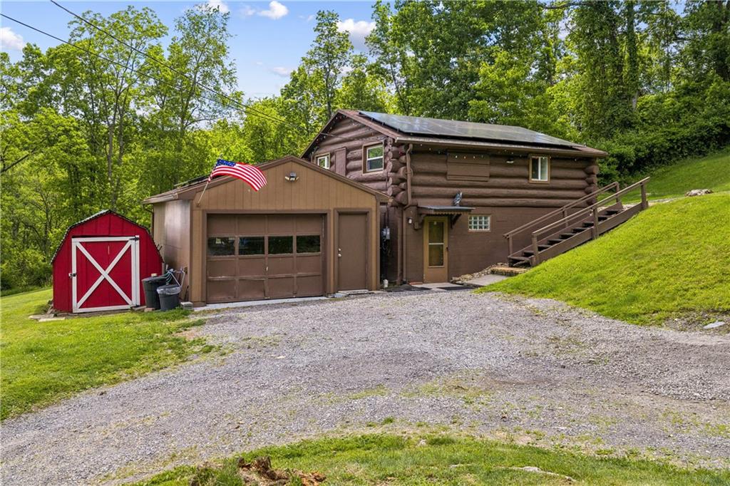 121 Valley Road Sewickley, PA 15143 - Photo 16 of 31 Side of home with large garage and a shed