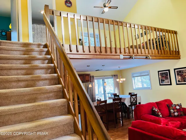 a view of entryway with wooden floor and stairs