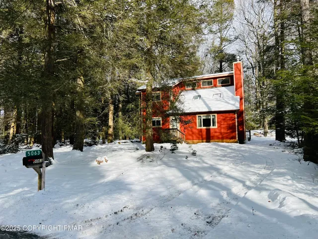 a view of the street of a house