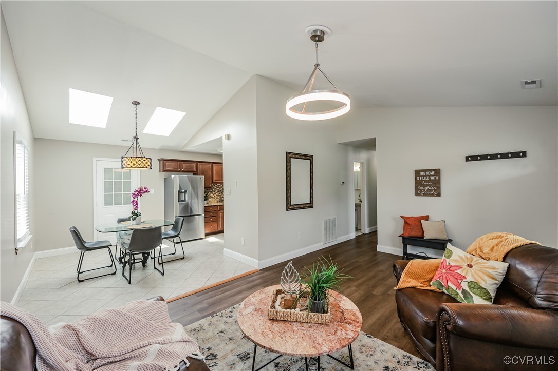 9286 Hungary Road Glen Allen, VA 23060 - Photo 13 of 50 Living room featuring a skylight, vaulted ceiling,