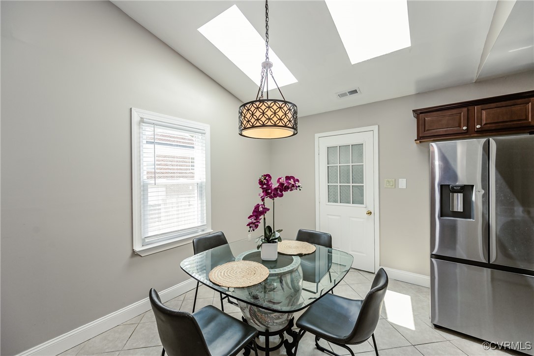 9286 Hungary Road Glen Allen, VA 23060 - Photo 24 of 50 Dining area featuring a skylight, light tile patte
