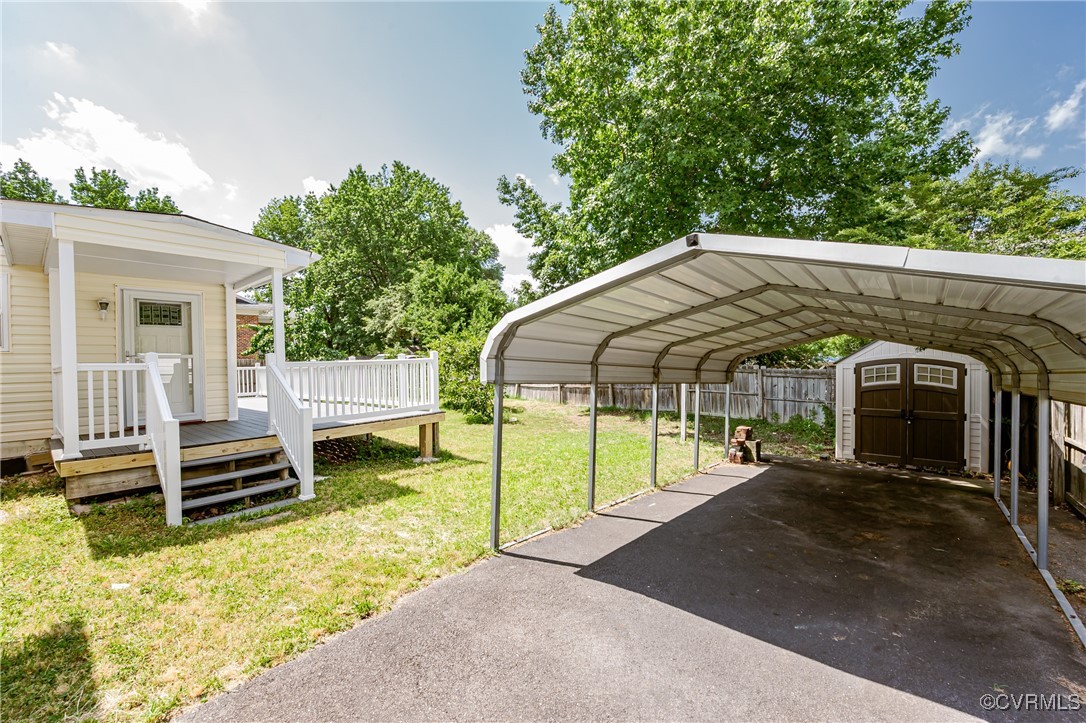 9286 Hungary Road Glen Allen, VA 23060 - Photo 5 of 50 View of parking / parking lot featuring a shed, a