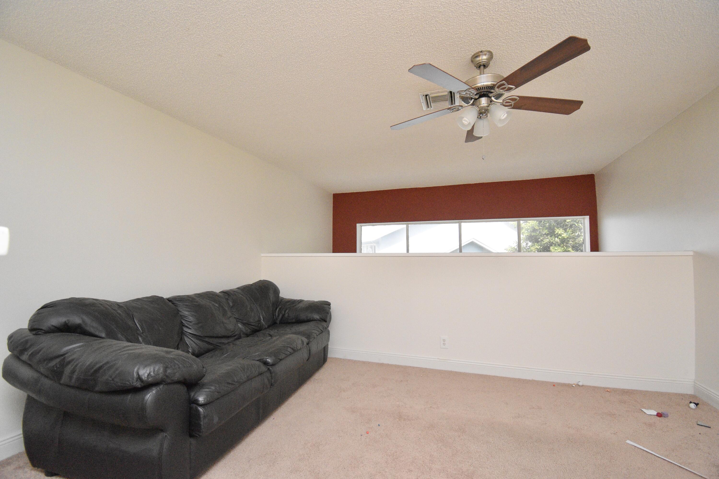 6053 Old Court Road, Unit 308 Boca Raton, FL 33433 - Photo 14 of 22 a living room with furniture and a window