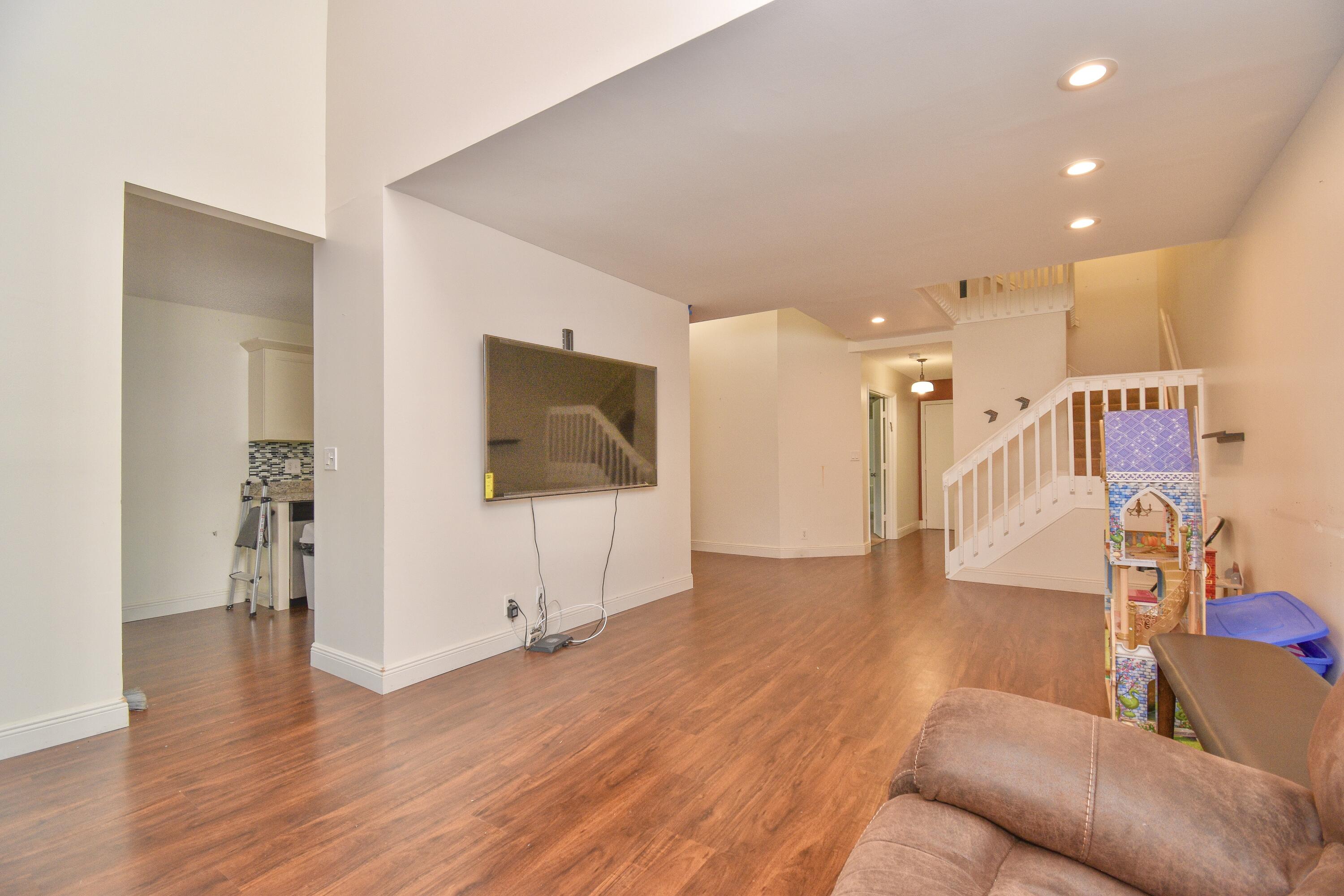 6053 Old Court Road, Unit 308 Boca Raton, FL 33433 - Photo 7 of 22 a living room with furniture and a flat screen tv