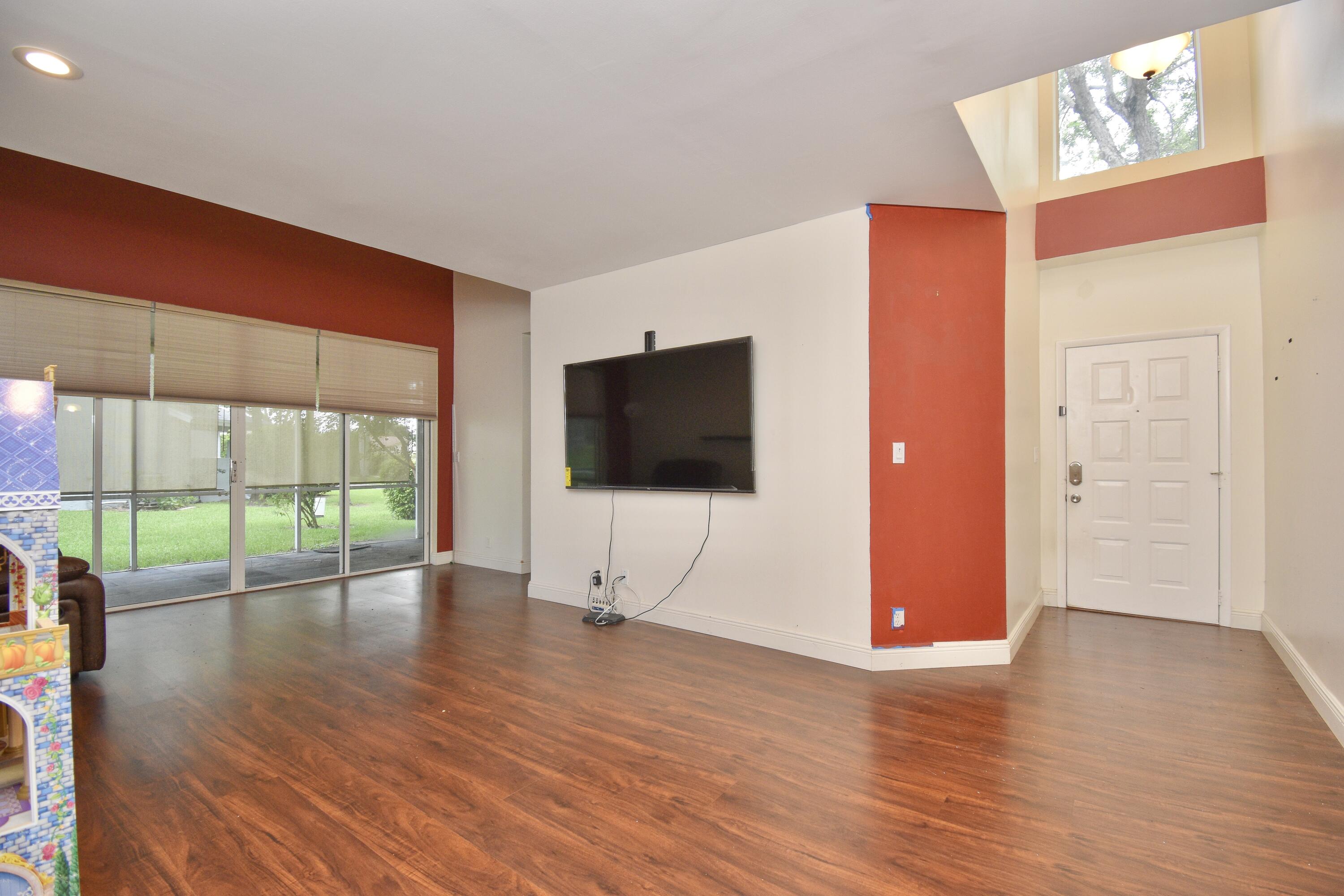 6053 Old Court Road, Unit 308 Boca Raton, FL 33433 - Photo 9 of 22 a view of empty room with wooden floor and fan