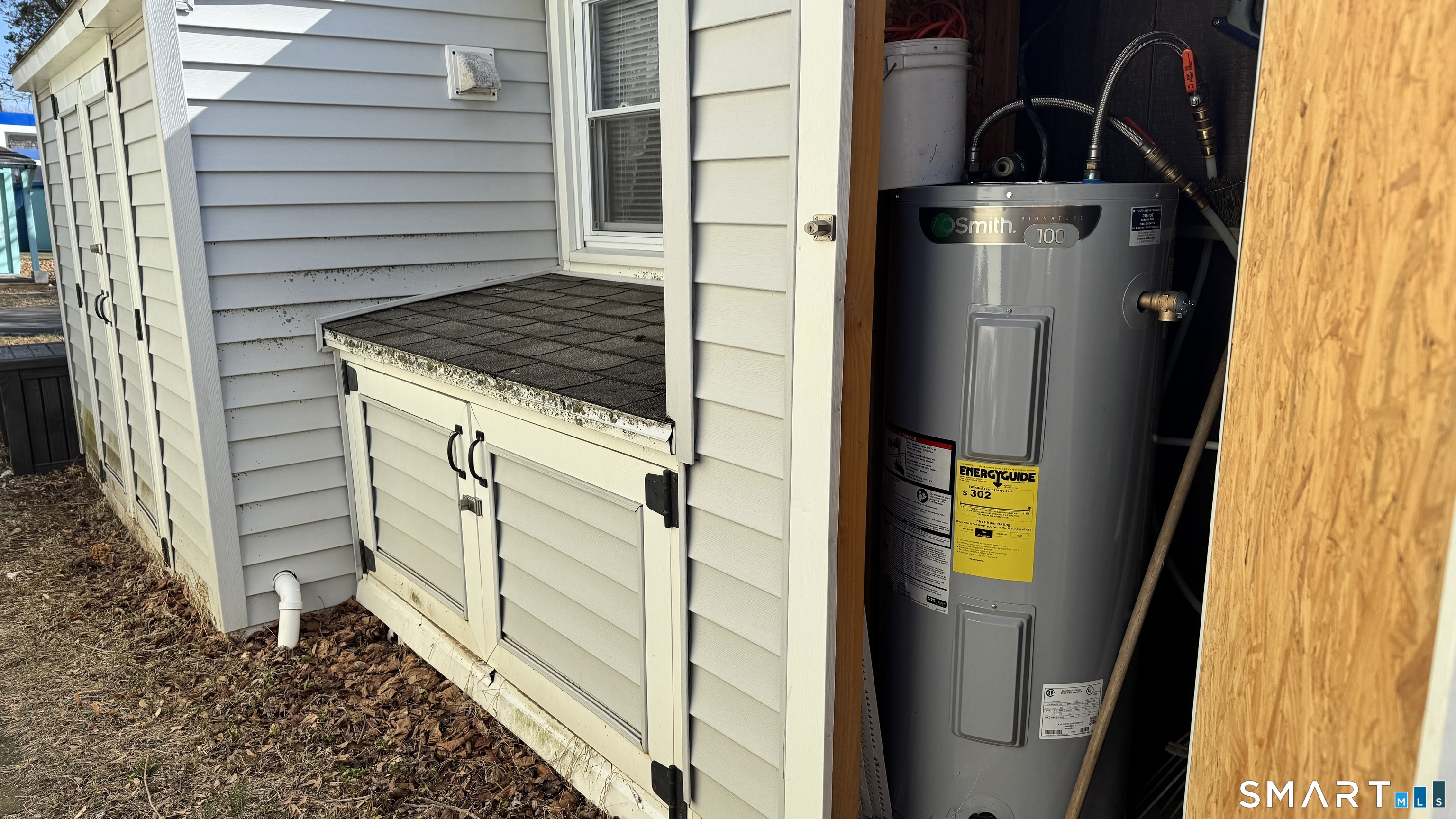 16 North Street Madison, CT 06443 - Photo 22 of 25 Shed with water heater