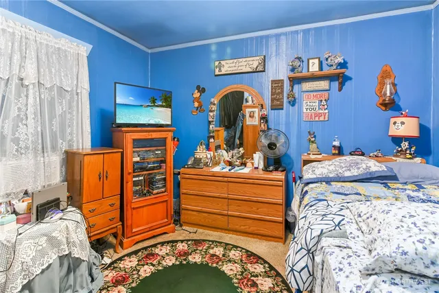 a bed room with a bed and a baby crib