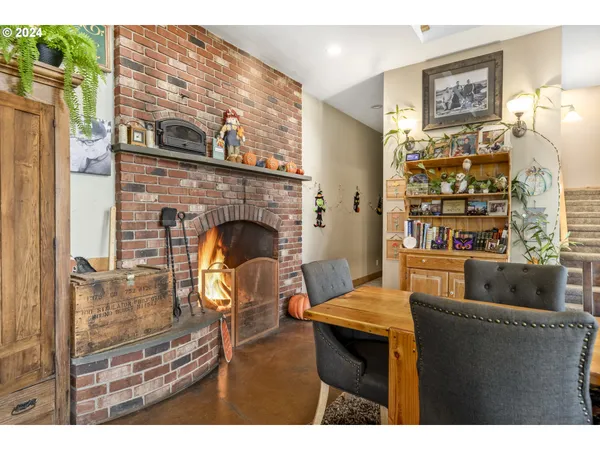 a dining room with furniture and a fireplace